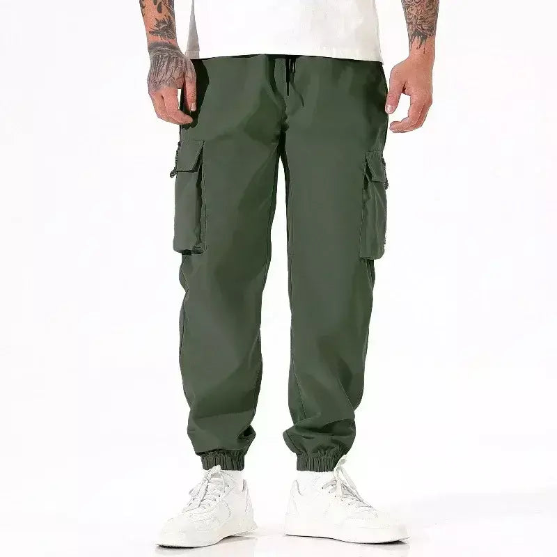 Calça masculina casual de pesca ao ar livre, à prova de vento, respirável, multi pacote, solta, confortável, para todas as estações, casual, versátil, esportiva