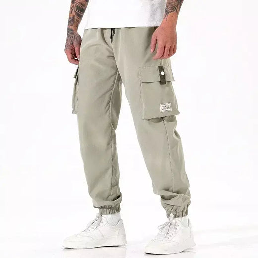 Calça masculina casual de pesca ao ar livre, à prova de vento, respirável, multi pacote, solta, confortável, para todas as estações, casual, versátil, esportiva