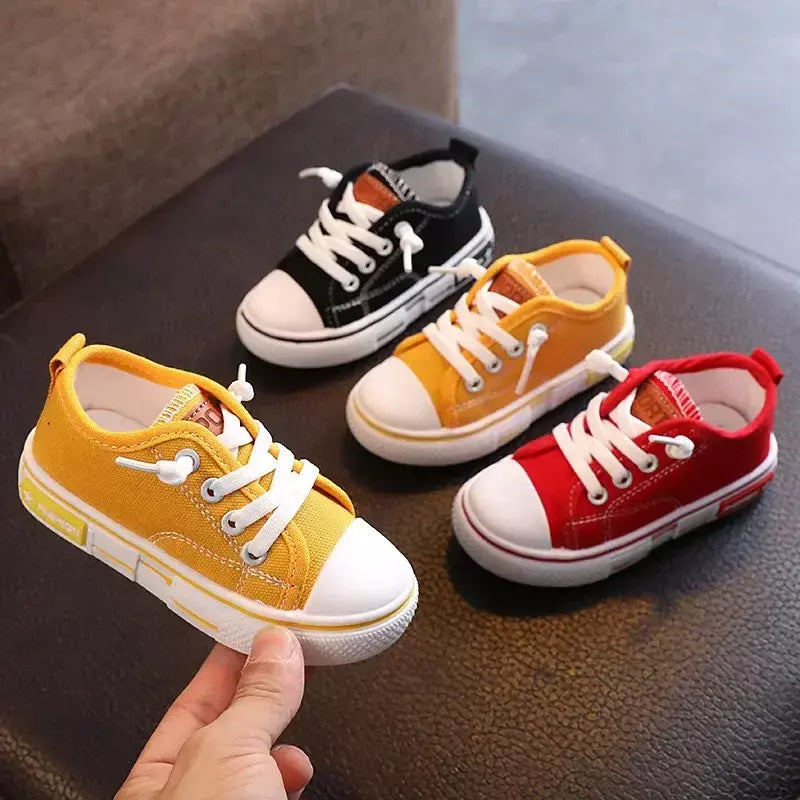 Sapatos canva de cano baixo infantil 2025 primavera novo estilo branco doce cor masculino feminino infantil pai-filho sapatos de tabuleiro