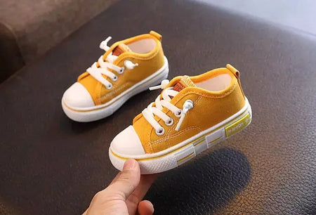 Sapatos canva de cano baixo infantil 2025 primavera novo estilo branco doce cor masculino feminino infantil pai-filho sapatos de tabuleiro