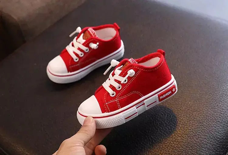 Sapatos canva de cano baixo infantil 2025 primavera novo estilo branco doce cor masculino feminino infantil pai-filho sapatos de tabuleiro