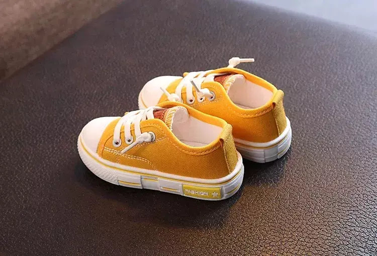 Sapatos canva de cano baixo infantil 2025 primavera novo estilo branco doce cor masculino feminino infantil pai-filho sapatos de tabuleiro