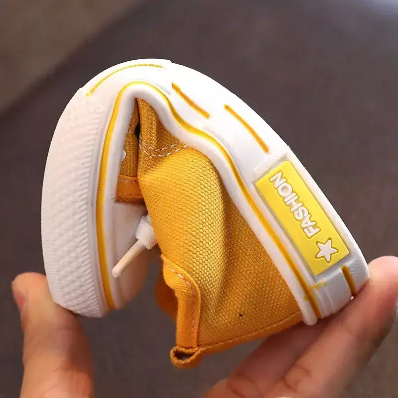 Sapatos canva de cano baixo infantil 2025 primavera novo estilo branco doce cor masculino feminino infantil pai-filho sapatos de tabuleiro