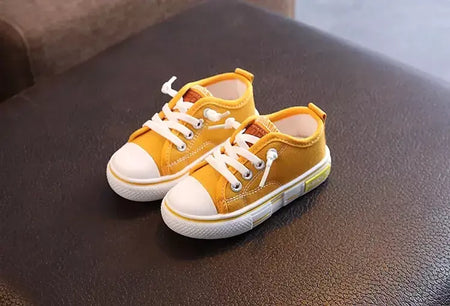 Sapatos canva de cano baixo infantil 2025 primavera novo estilo branco doce cor masculino feminino infantil pai-filho sapatos de tabuleiro