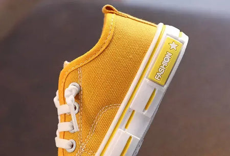 Sapatos canva de cano baixo infantil 2025 primavera novo estilo branco doce cor masculino feminino infantil pai-filho sapatos de tabuleiro