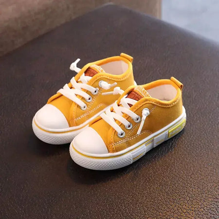Sapatos canva de cano baixo infantil 2025 primavera novo estilo branco doce cor masculino feminino infantil pai-filho sapatos de tabuleiro