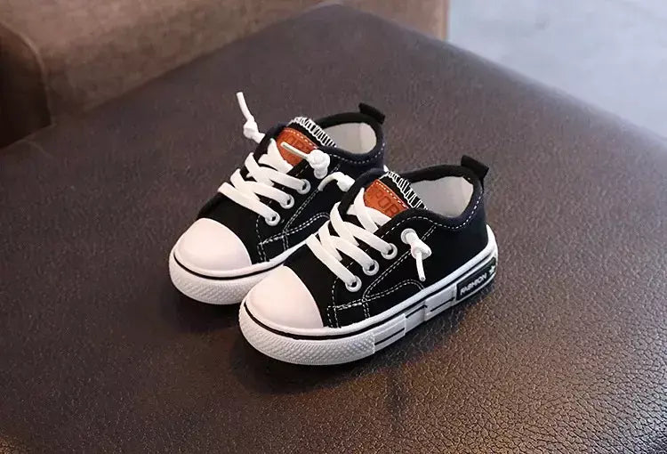 Sapatos canva de cano baixo infantil 2025 primavera novo estilo branco doce cor masculino feminino infantil pai-filho sapatos de tabuleiro
