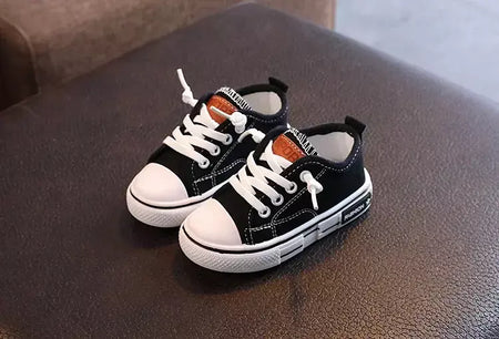 Sapatos canva de cano baixo infantil 2025 primavera novo estilo branco doce cor masculino feminino infantil pai-filho sapatos de tabuleiro