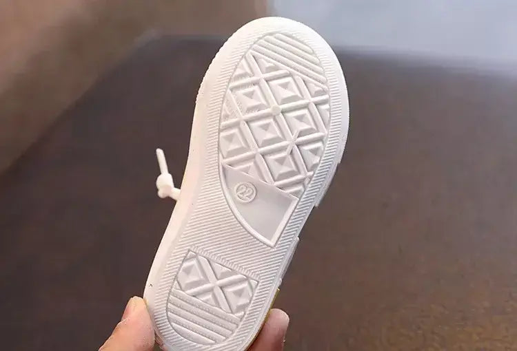 Sapatos canva de cano baixo infantil 2025 primavera novo estilo branco doce cor masculino feminino infantil pai-filho sapatos de tabuleiro